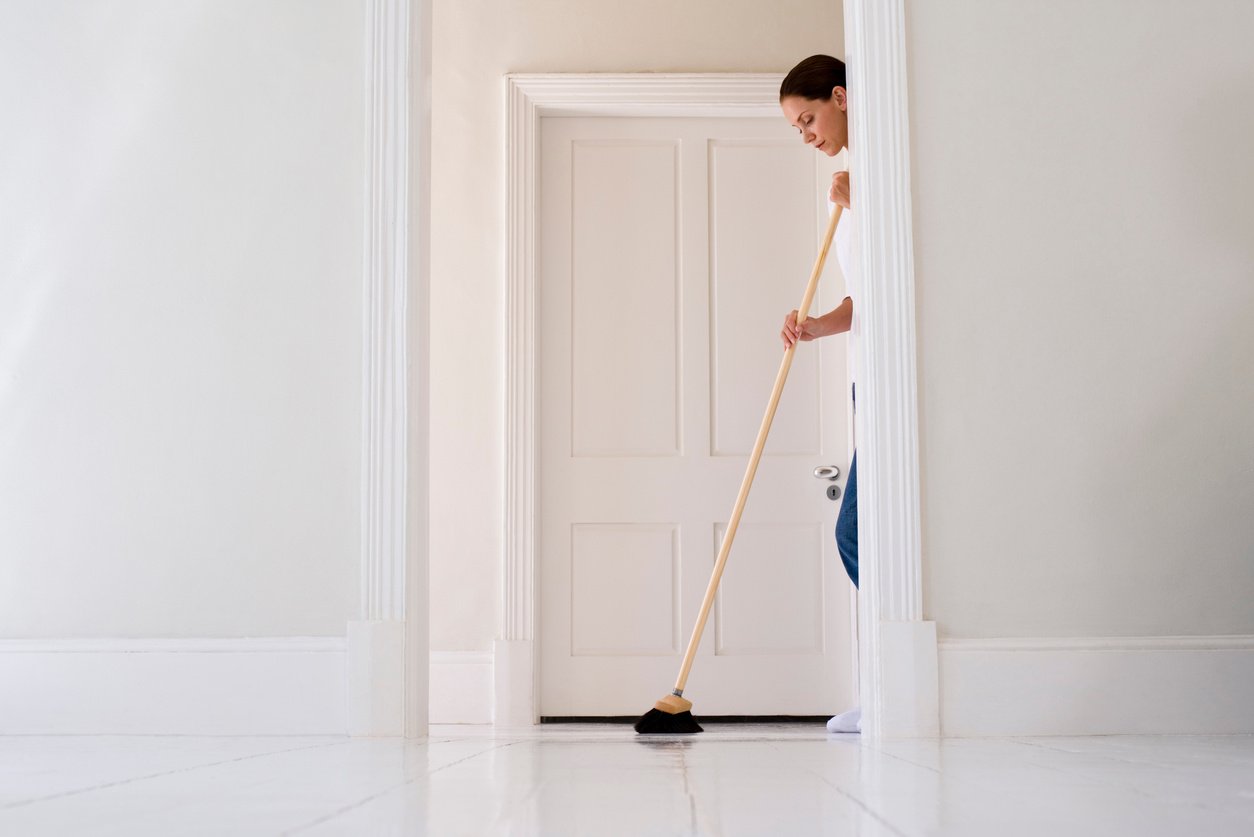 Woman sweeping floor